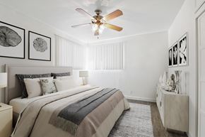 Beverly Hills apartment for rent - a bedroom with a large bed and a ceiling fan