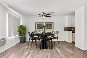 West Hollywood apartment for rent - A dining room with a table set for six.