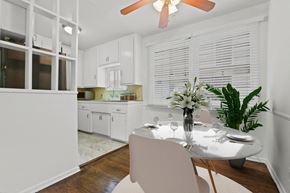 West Hollywood apartment for rent - A dining room with a table set for two and a plant on the table.