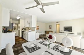 Northridge apartment for rent - a living room and dining room with a table and a ceiling fan