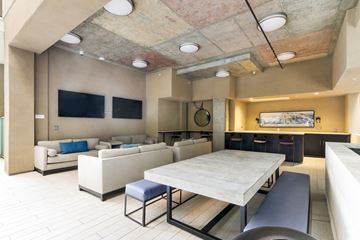Los Angeles apartment for rent - A modern living room with a large couch and a television.