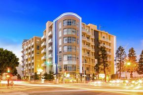 Los Angeles apartment for rent - A modern apartment building with a curved facade and multiple balconies.