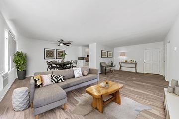 West Hollywood apartment for rent - A living room with a grey couch and a wooden coffee table.
