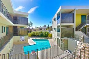 Arleta apartment for rent - A pool in a fenced in area outside a building.