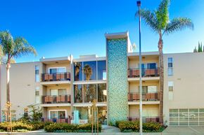 Valley Village apartment for rent - A tall building with a blue and white patterned tower in the middle of a sunny day.