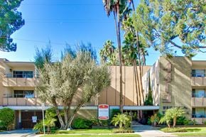 Sherman Oaks apartment for rent - A modern building with a red sign in front.