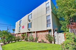 Reseda apartment for rent - A building with a red sign on it.