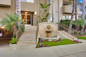 Sherman Oaks apartment for rent - A building with a stone fountain in front of it.