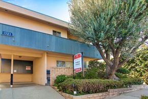 Los Angeles apartment for rent - A building with a sign that says "Foster Forward" in front of it.