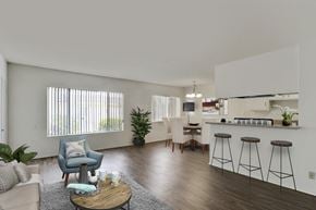 Los Angeles apartment for rent - a living room with a kitchen and a bar with stools