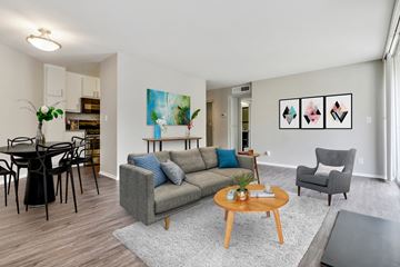 Los Angeles apartment for rent - A living room with a grey couch, a coffee table, and a painting on the wall.