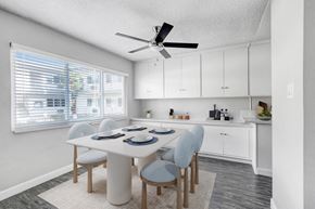 Studio City apartment for rent - a dining room with a table and chairs and a ceiling fan