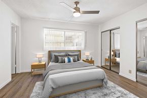 Los Angeles apartment for rent - A bedroom with a large bed and a ceiling fan.