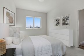 Canoga Park apartment for rent - a bedroom with a bed and two windows