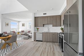 San Pedro apartment for rent - A modern kitchen with a dining table and chairs.