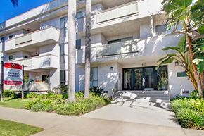 Los Angeles apartment for rent - A white building with a Bentley sign in front.