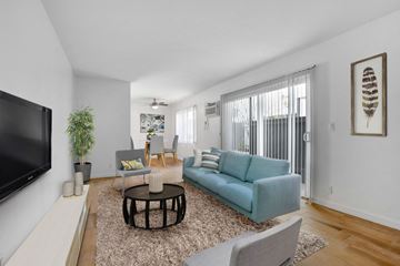 Los Angeles apartment for rent - A living room with a blue couch and a flat screen TV.