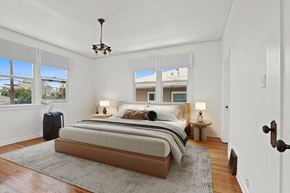 Los Angeles apartment for rent - a bedroom with a bed and three windows