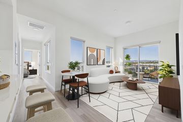 Culver City apartment for rent - A living room with a white sofa and a coffee table.