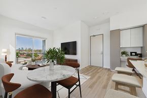 Culver City apartment for rent - A modern dining room with a table set for four.
