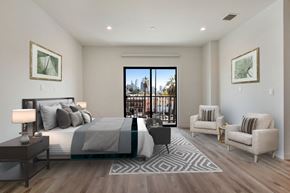 Los Angeles apartment for rent - a bedroom with a bed and a chair in a room