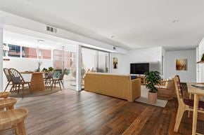 Santa Monica apartment for rent - a living room and dining area with a couch and a table