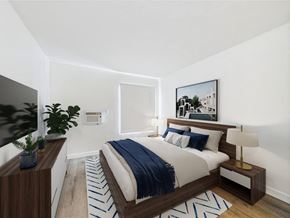 Los Angeles apartment for rent - A modern bedroom with a large bed and a painting on the wall.