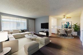 Los Angeles apartment for rent - A living room with a white couch and a television.