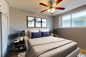 Los Angeles apartment for rent - A bedroom with a large bed and a ceiling fan.