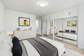 Northridge apartment for rent - a bedroom with a bed and a mirror