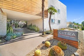 Burbank apartment for rent - the entrance to cimarron apartment homes with cactus and other plants