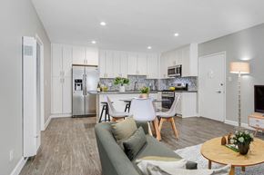 Los Angeles apartment for rent - A modern kitchen with a dining area and a living room.