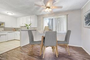 Sherman Oaks apartment for rent - A dining room with a table and chairs.