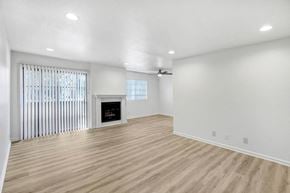 Studio City apartment for rent - a living room with white walls and a fireplace