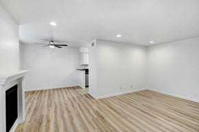 Studio City apartment for rent - an empty living room with white walls and wood flooring