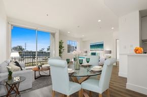 Los Angeles apartment for rent - A dining room with a glass table and chairs.