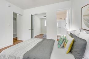 Los Angeles apartment for rent - A bedroom with a bed and a painting on the wall.