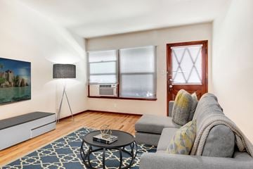 Valley Village apartment for rent - A living room with a grey couch and a black coffee table.