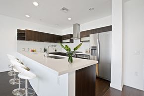 Culver City apartment for rent - A kitchen with a white counter top and a plant on it.