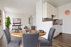 Century City apartment for rent - A dining room with a table set for two and a potted plant on the side.