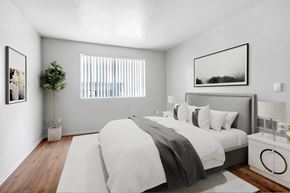 Van Nuys apartment for rent - a bedroom with a large bed and a window