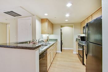 Gourmet kitchen with black whirlpool appliances