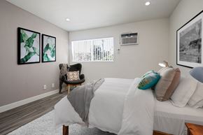 Los Angeles apartment for rent - A bedroom with a large bed and a chair.
