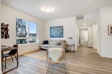 Los Angeles apartment for rent - A living room with a couch, chairs, and a painting on the wall.