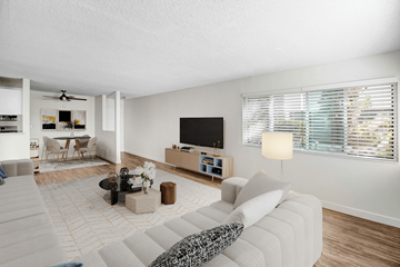 Sherman Oaks apartment for rent - A living room with a white couch and a television.