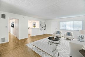 Studio City apartment for rent - a living room with white furniture and a white rug