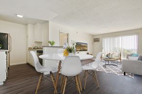 Los Angeles apartment for rent - A white dining table with four chairs in a modern kitchen.