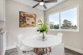 Arleta apartment for rent - A dining room with a white table and chairs.