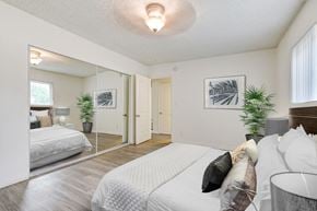 Arleta apartment for rent - A bedroom with a large bed and a mirror on the wall.