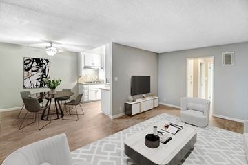 Valley Village apartment for rent - A living room with a white couch and a television.